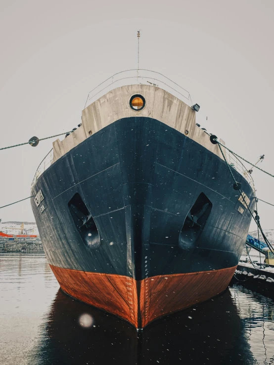 a large boat sitting on top of a body of water, a portrait, by Kristian Zahrtmann, pexels contest winner, modernism, shipyard, front side, upscaled to high resolution, multiple stories