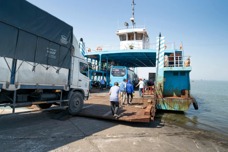 a group of people loading a truck onto a ferry, unsplash, hurufiyya, avatar image, afar, maintenance photo, thumbnail