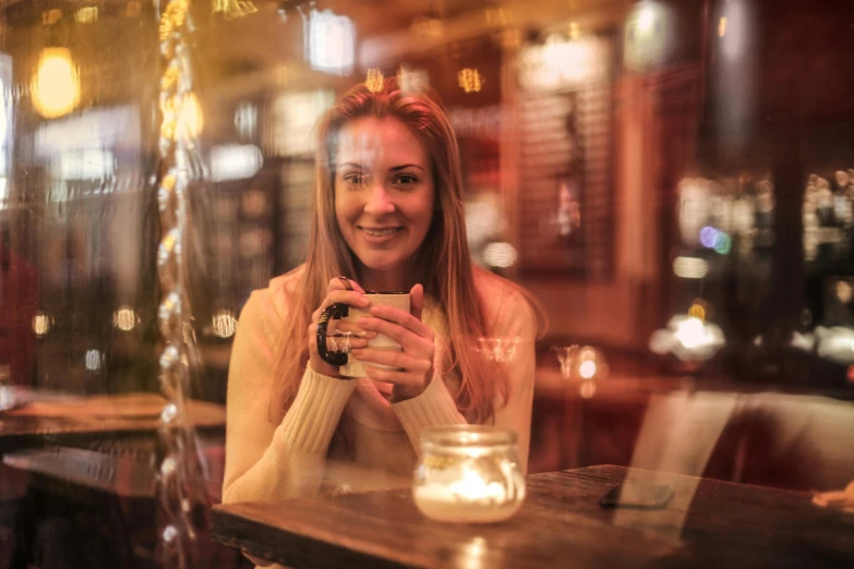 a woman sitting at a table with a cup of coffee, a portrait, pexels contest winner, flashing lights, in the pub, avatar image, winter setting