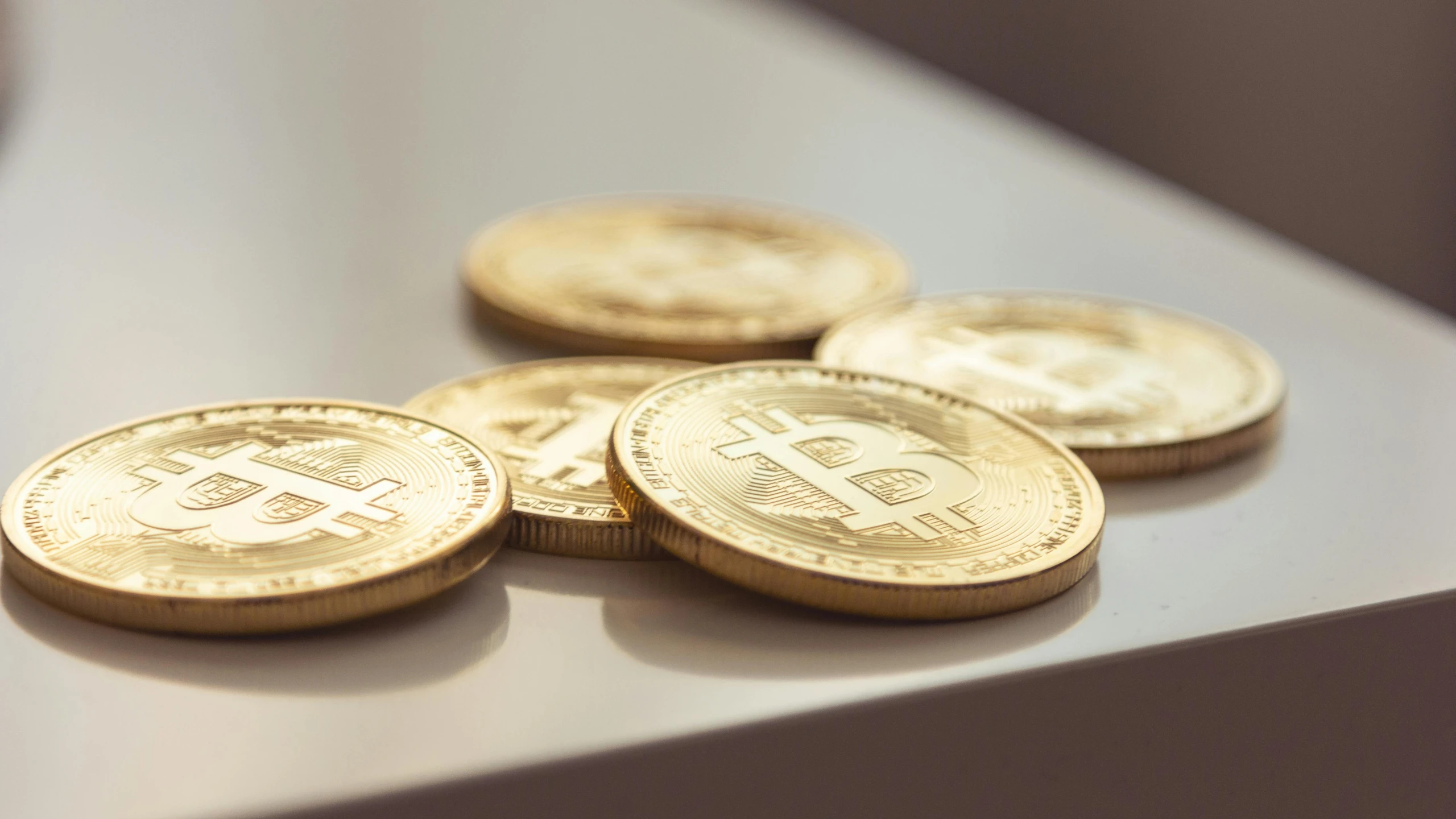 a pile of bitcoins sitting on top of a table, unsplash, private press, on a white table, rule of three, in a row, detailed product image