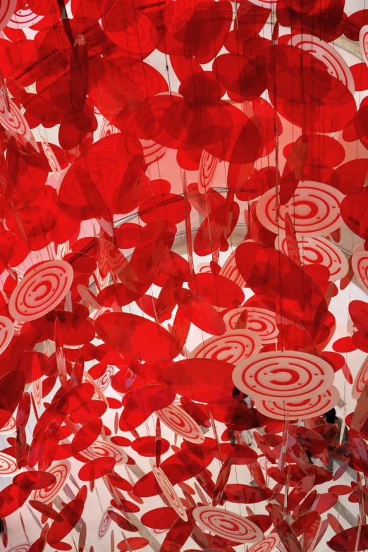 a room filled with lots of red and white lollipops, a digital rendering, inspired by Chiharu Shiota, swirling flowers, closeup shot, peppermint motif, demur