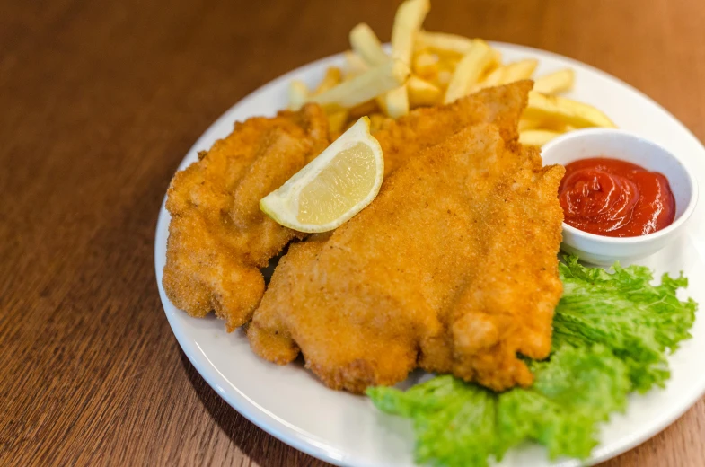 a white plate topped with fried fish and french fries, te pae, daily specials, bear legs, thumbnail