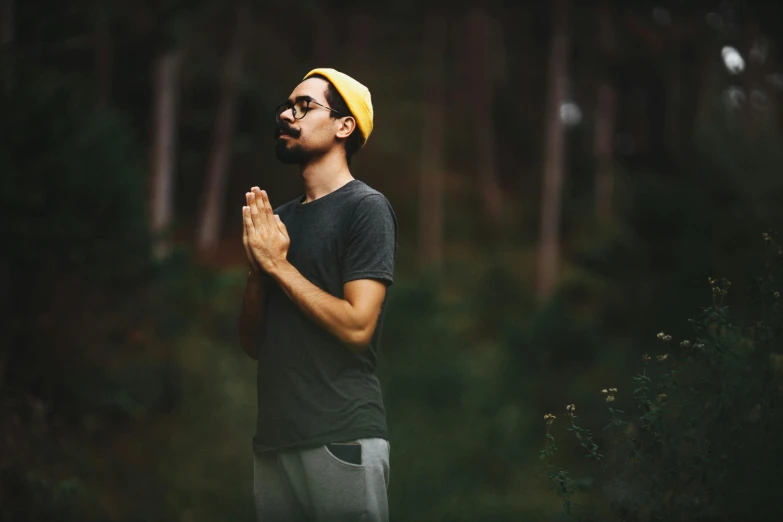 a man standing in the middle of a forest, praying meditating, avatar image