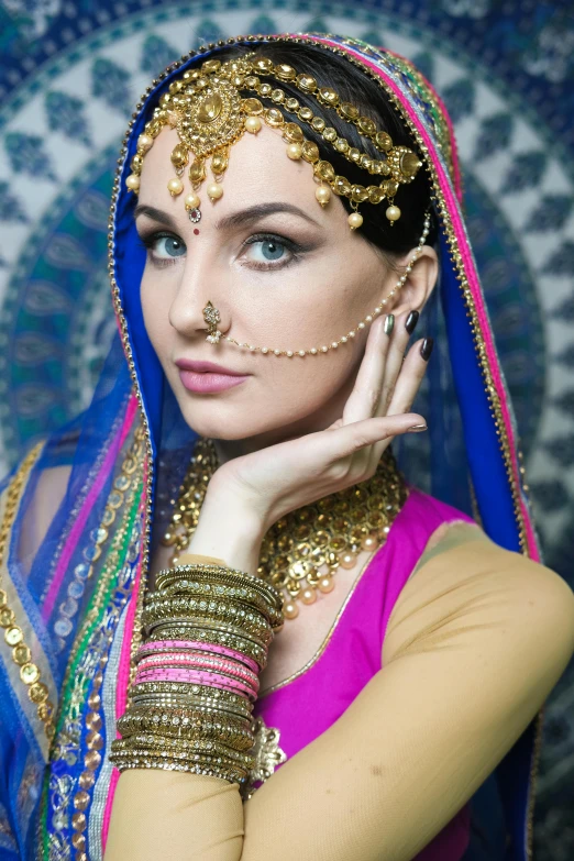 a woman in a colorful outfit posing for a picture, a portrait, by Manjit Bawa, renaissance, forehead jewelry, ukrainian, elegant glamor pose, square