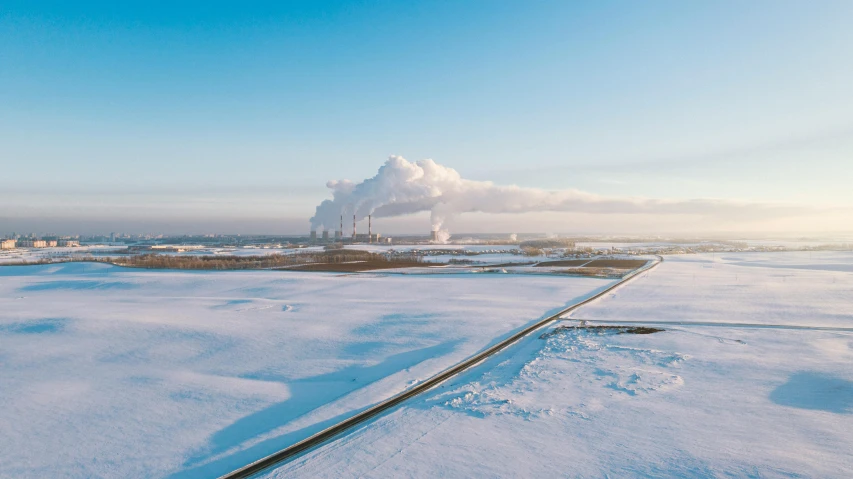 a train traveling through a snow covered field, pexels contest winner, land art, power plants, panoramic shot, graphic print, icelandic landscape
