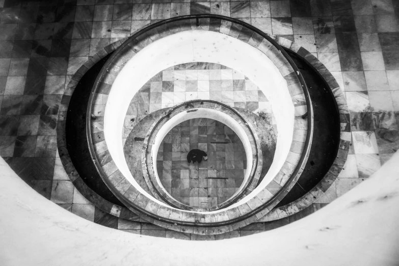 a black and white photo of a spiral staircase, by Kristian Zahrtmann, unsplash contest winner, marble hole, soviet architecture, circle pit, lomography photo