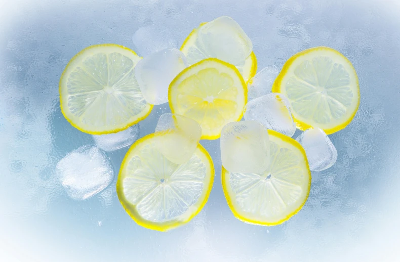 a group of lemon slices sitting on top of ice, pexels, detailed product image, viewed from below, cryogenic pods, refreshing colour