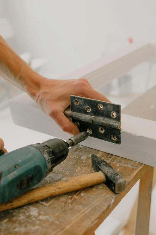 a person using a hammer to cut a piece of wood, pexels contest winner, screws and bolts, architectural finishes, transforming, thumbnail