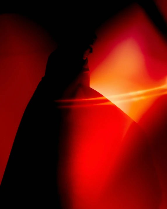 a silhouette of a person holding a tennis racquet, inspired by Man Ray, unsplash, lyrical abstraction, long red cape, refracted light, ( ( theatrical ) ), lava lamp