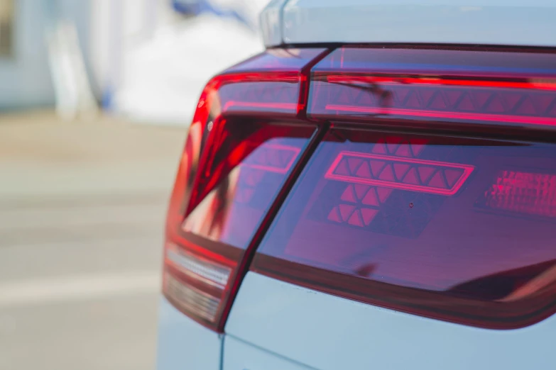 a close up of the tail lights of a car, pexels contest winner, touareg, holographic accents, azure and red tones, opaque glass