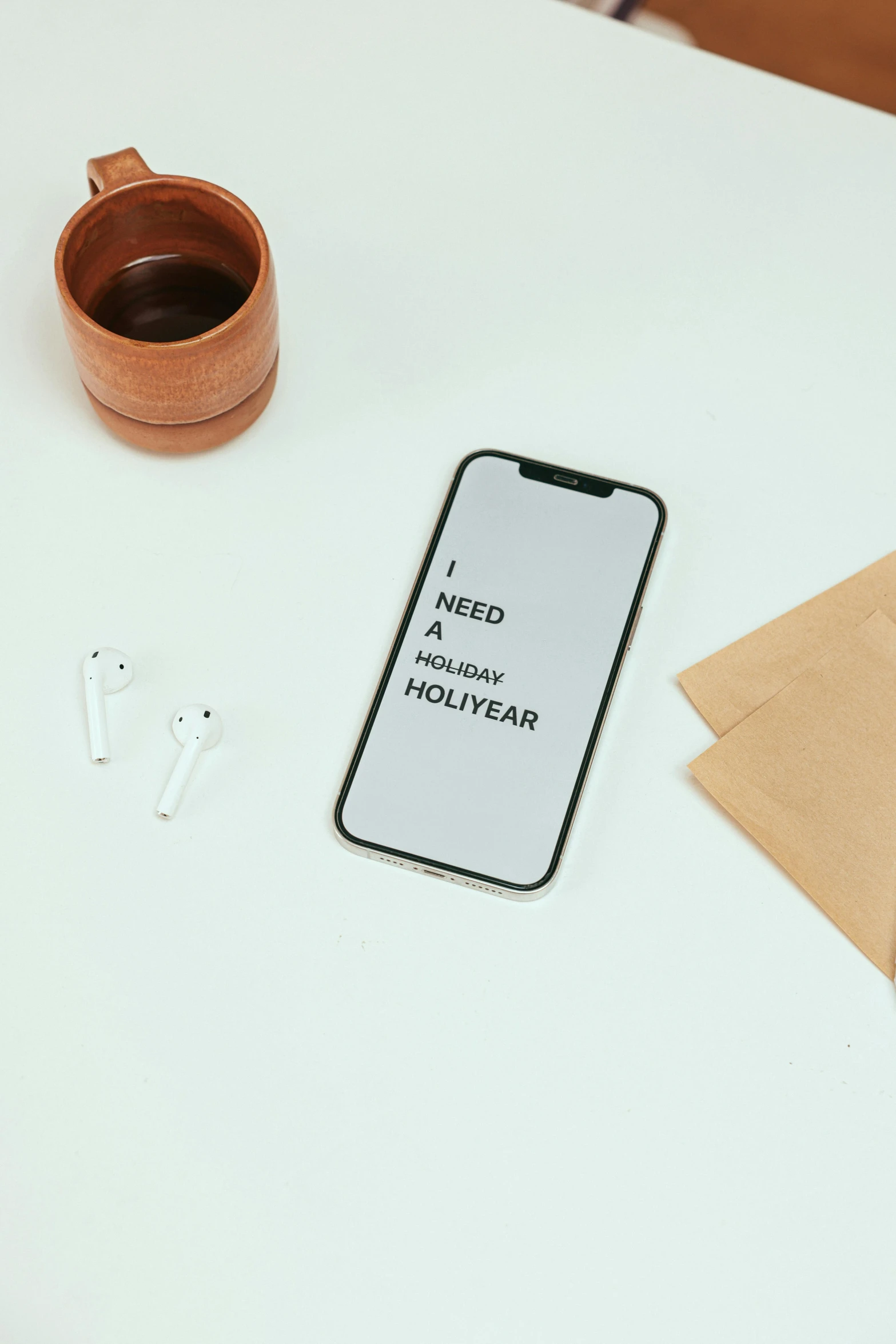 a cell phone sitting on top of a table next to a cup of coffee, by Holger Roed, trending on unsplash, holography, modernist headphones, behance lemanoosh, written in a neat, porcelain holly herndon statue