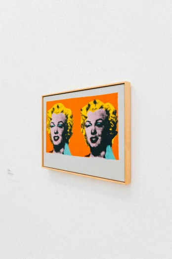 a couple of paintings hanging on a wall, inspired by Warhol, unsplash, pop art, stanley kubrick movie frame, orange head, marilyn monroe, high - resolution scan