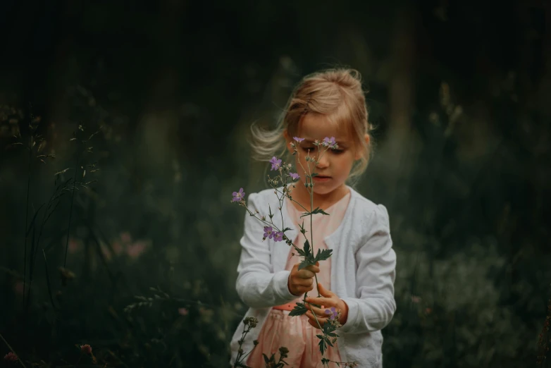 a little girl holding a bunch of flowers, pexels contest winner, romanticism, paul barson, looking at the ground, playing, small