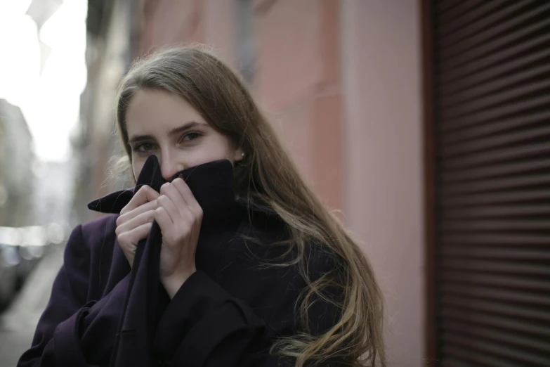 a close up of a person wearing a coat, pexels contest winner, shy and demure, teenage girl, music video, portrait image