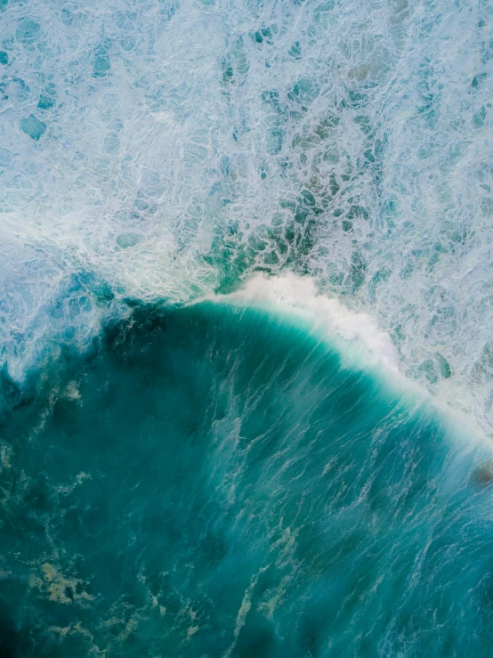 a man riding a wave on top of a surfboard, pexels contest winner, renaissance, drone view, teal aesthetic, profile image, looking threatening