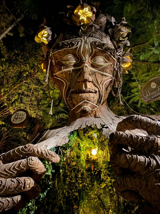 a close up of a statue of a person, inspired by Wendy Froud, pexels contest winner, ecological art, city lights made of lush trees, magic parade float, new zealand, made of intricate metal and wood
