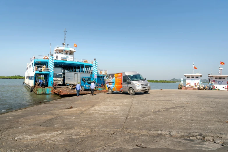 a blue and white boat sitting on top of a body of water, a portrait, vehicles, nuttavut baiphowongse, avatar image, maintenance photo