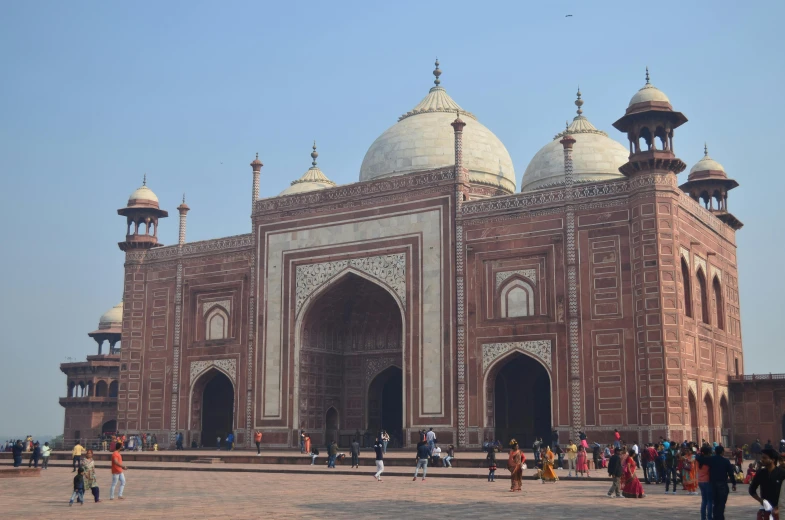 a group of people standing in front of a building, inspired by Steve McCurry, pexels contest winner, hurufiyya, mausoleum, mogul khan, 2 5 6 x 2 5 6 pixels, huge gate