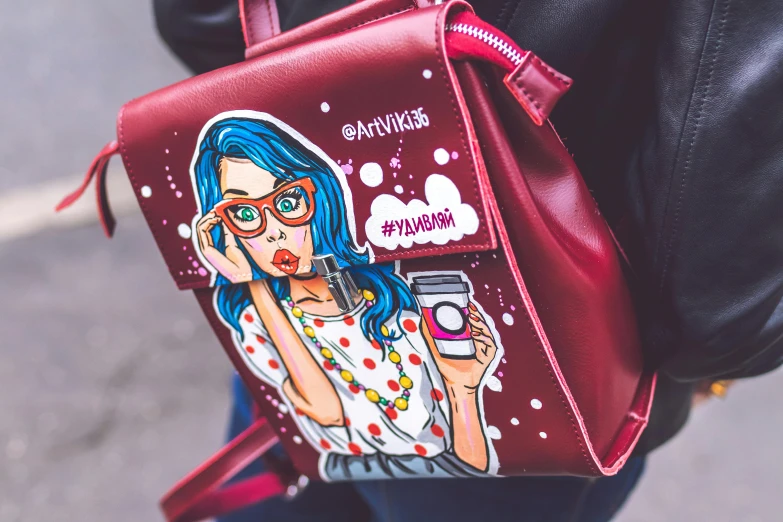 a red backpack with a picture of a woman on it, an airbrush painting, trending on pexels, colorful comics style, girl with glasses, cute detailed artwork, fashionista