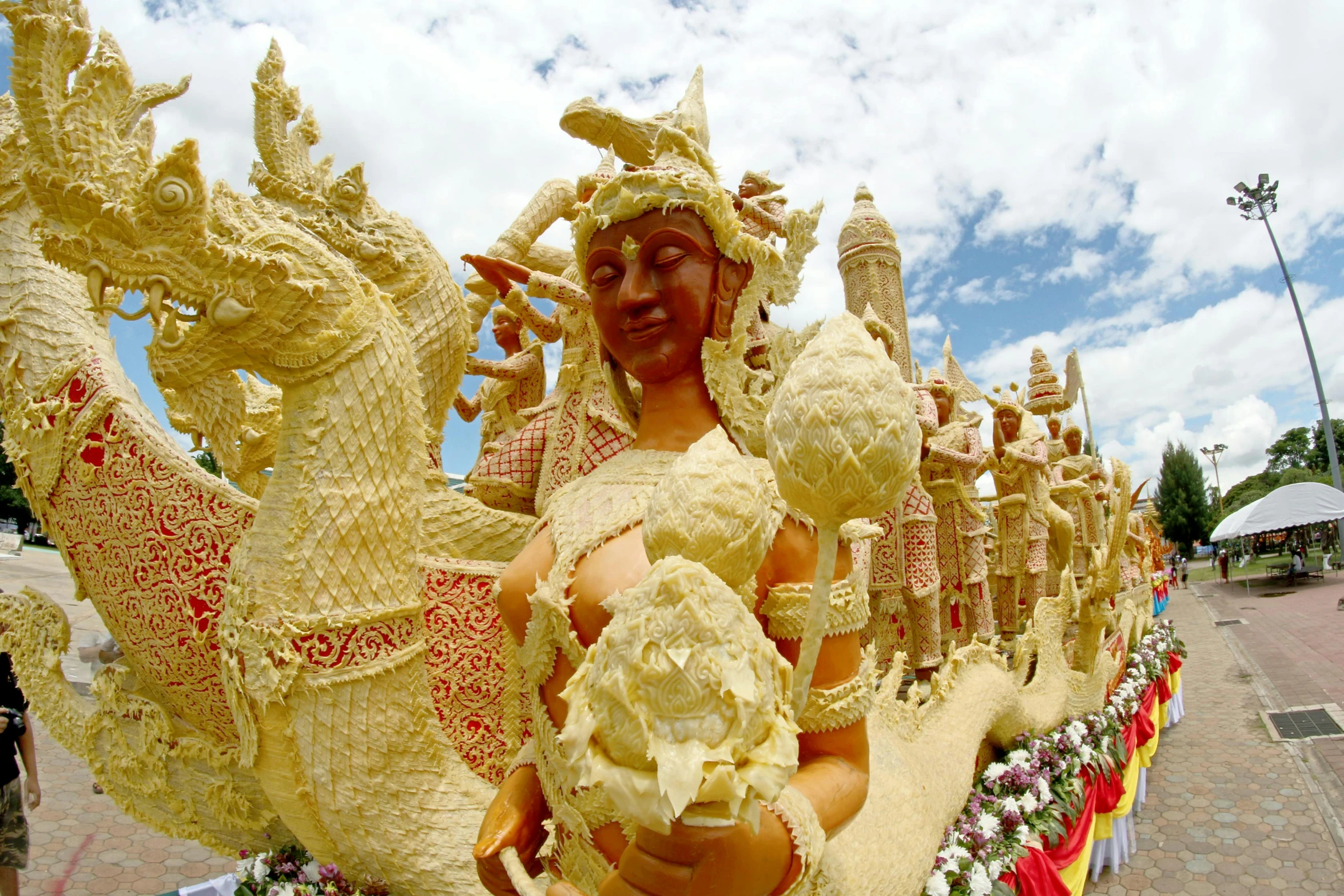 a close up of a statue of a person on a boat, parade floats, golden intricate details, ivory, stunning scenery