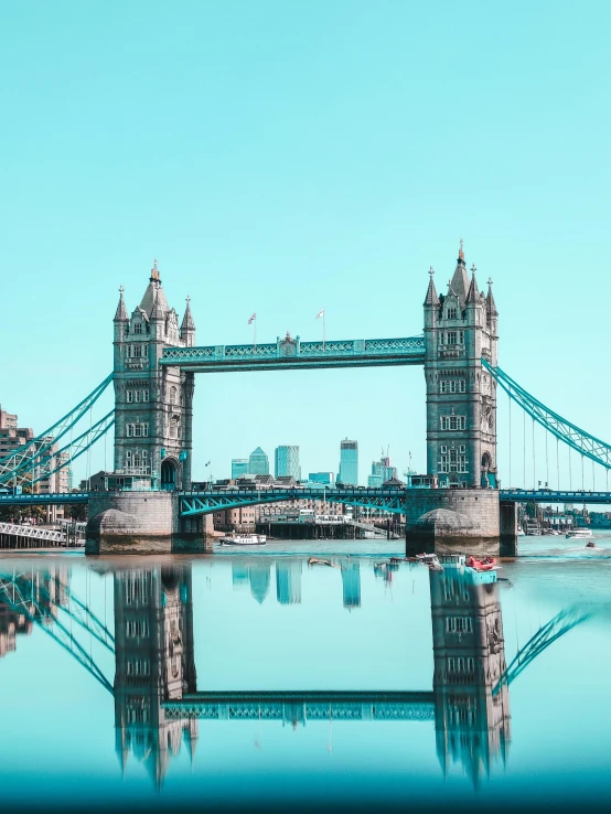 the tower bridge is reflected in the water, pexels contest winner, hyperrealism, brown and cyan blue color scheme, today\'s featured photograph 4k, thumbnail, high quality product image”