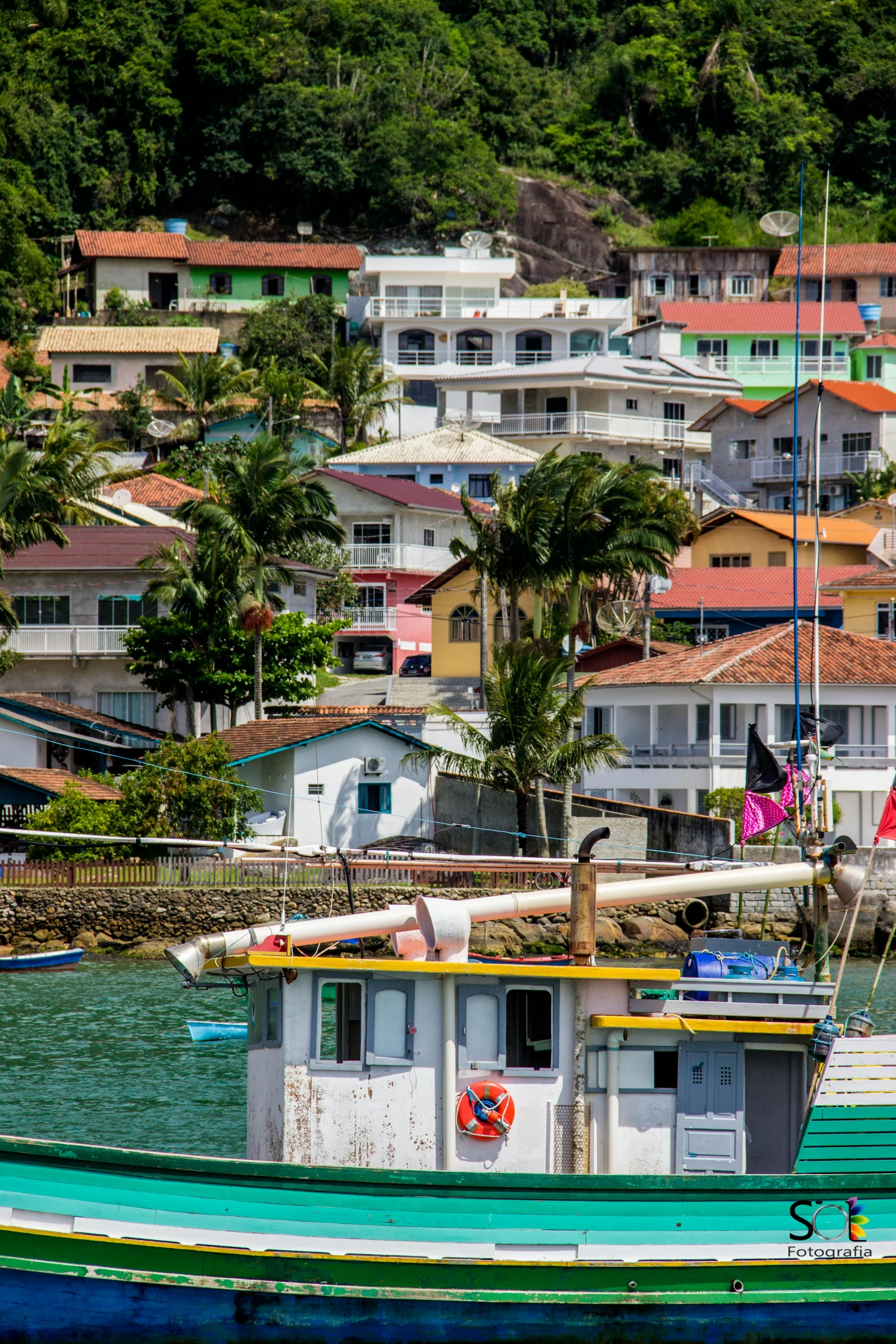 a boat that is sitting in the water, by Felipe Seade, colorful houses, slide show, square, brazilian