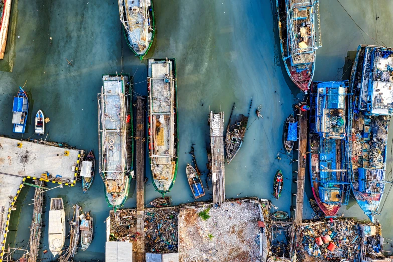 a group of boats sitting on top of a body of water, pexels contest winner, process art, satellite imagery, hou china, shipping docks, thumbnail