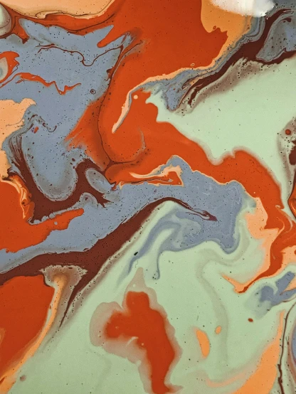 a close up of a plate of food on a table, inspired by Michelangelo, reddit, abstract art, acrylic paint pour, grey orange, album cover, lagoon