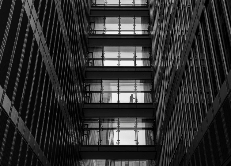 a black and white photo of a tall building, unsplash contest winner, looking outside, awarded on cgsociety, people at work, balconies