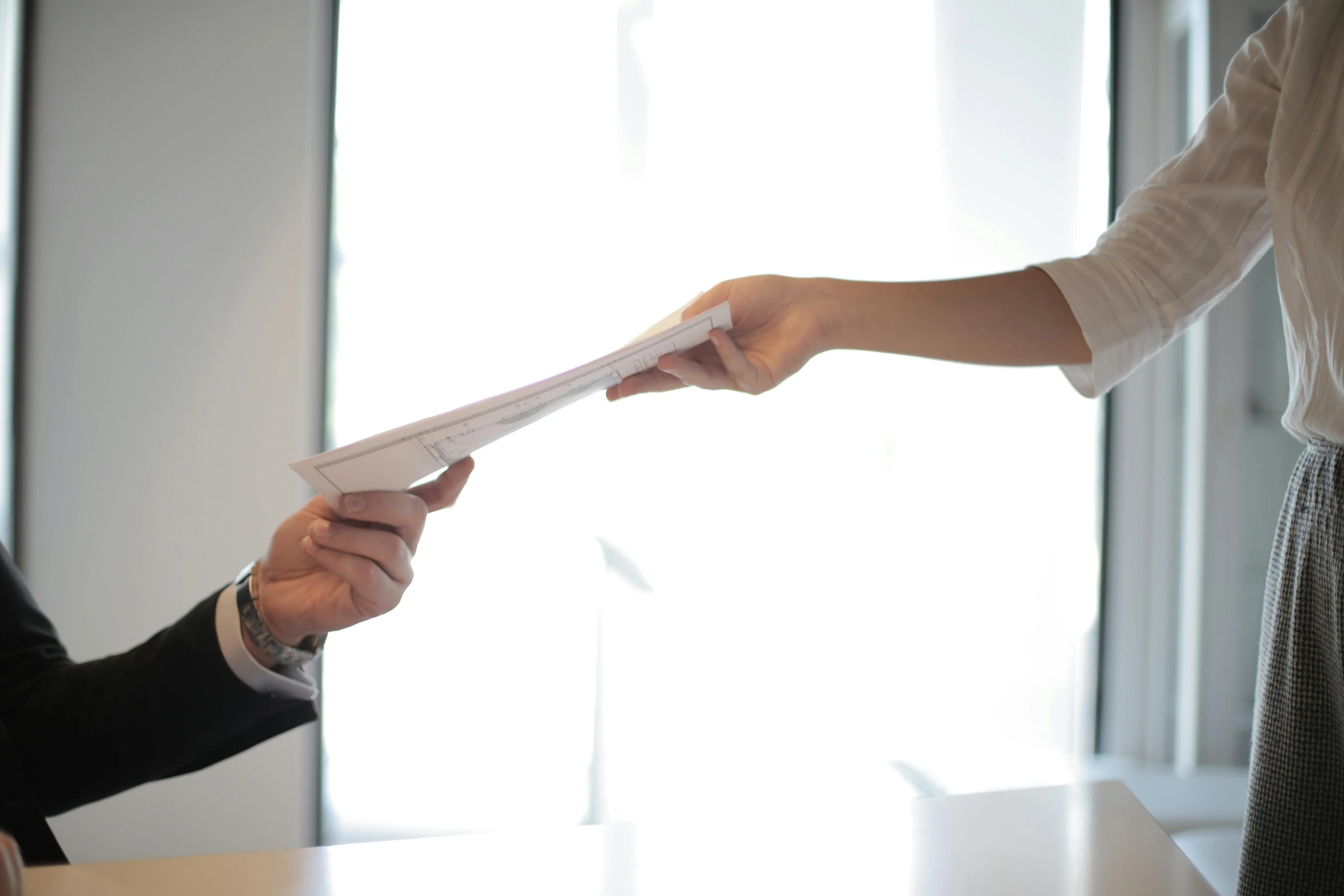 a woman handing a piece of paper to a man, by Niko Henrichon, pexels contest winner, hovering indecision, scientific document, white paper, raising an arm