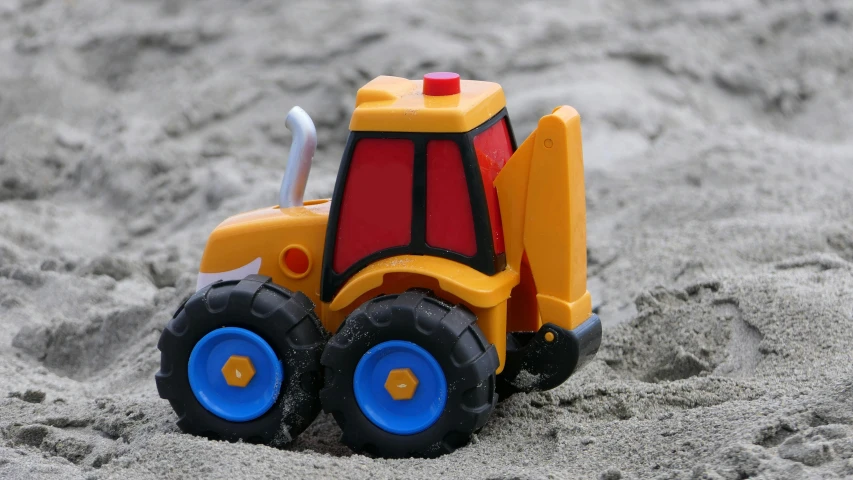 a toy truck sitting on top of a sandy beach, square jaw, jcb, thumbnail, high-quality photo