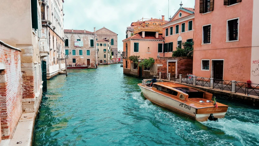 a boat traveling down a river next to buildings, by Carey Morris, pexels contest winner, venice biennale, floating. greenish blue, 🚿🗝📝, promo image