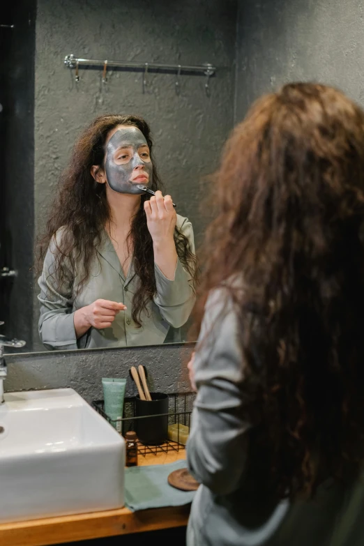 a woman brushing her teeth in front of a mirror, pexels contest winner, renaissance, face covered in dirt, going gray, black facemask, brunette