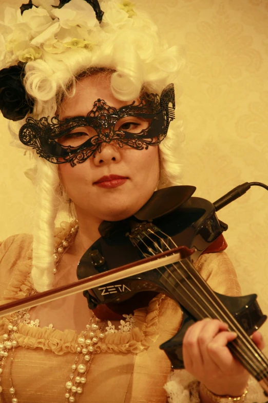 a woman in a masquerade playing a violin, an album cover, inspired by Karl Bryullov, flickr, wearing victorian goggles, brocade, and