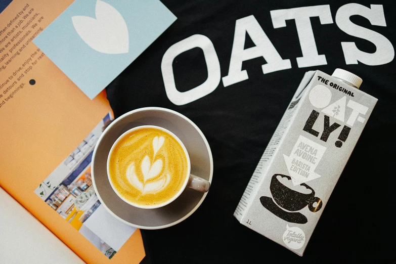 a cup of coffee next to a carton of oats, inspired by Oskar Lüthy, unsplash contest winner, graffiti, latte art, on the qt, press shot, oaks