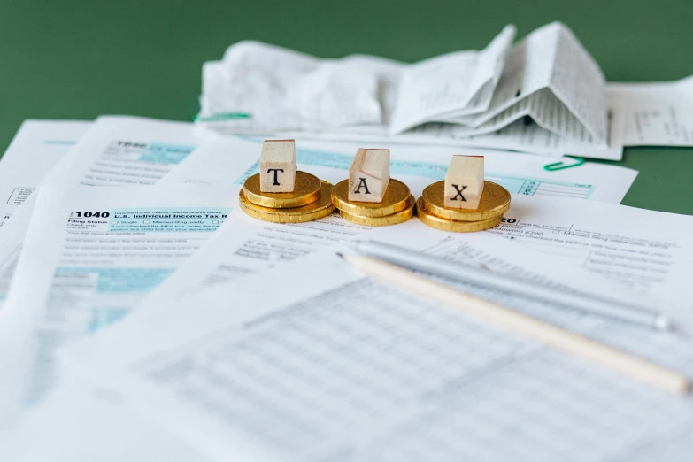 a pile of papers sitting on top of a table, by Alejandro Obregón, pexels contest winner, currency symbols printed, taejune kim, thumbnail, rule of three