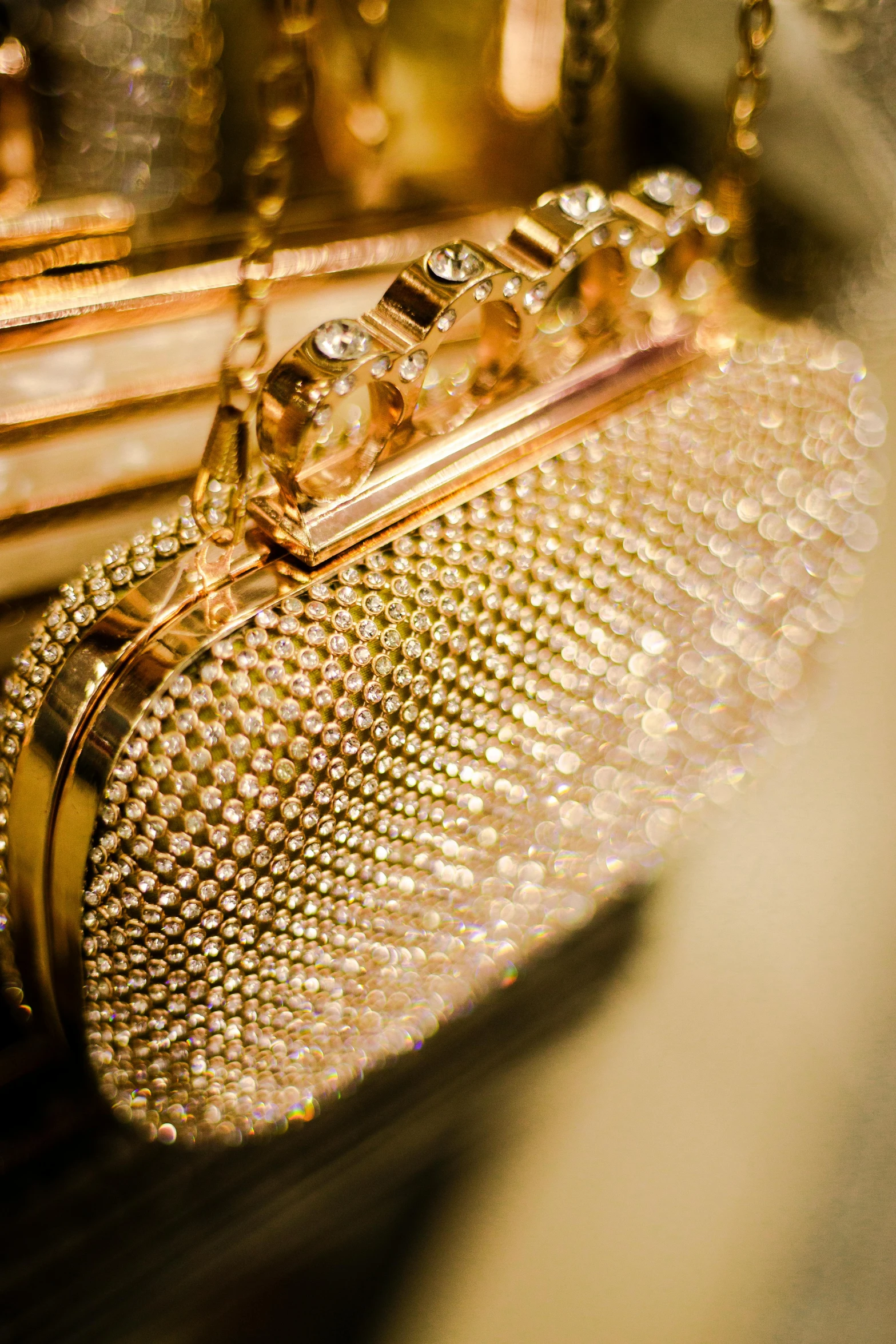 a gold purse sitting on top of a table, intricate sparkling atmosphere, up close, swarovski style, highly polished