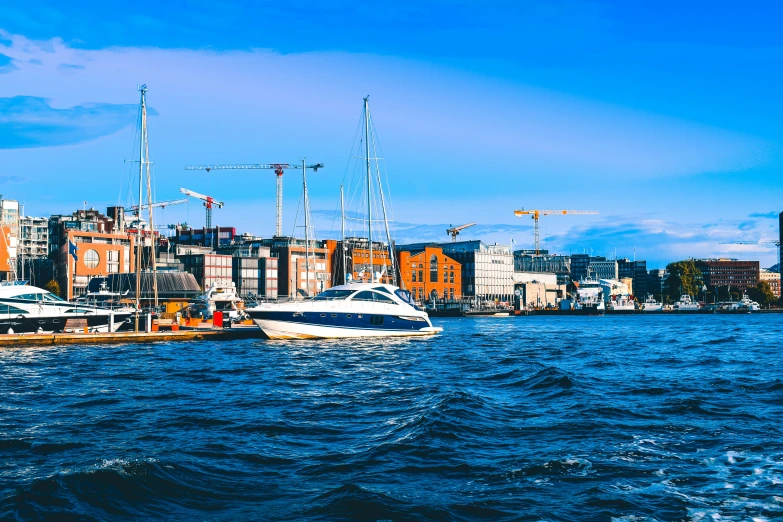 a group of boats floating on top of a body of water, inspired by Wilhelm Marstrand, pexels contest winner, swedish urban landscape, 🚿🗝📝, thumbnail, harbor