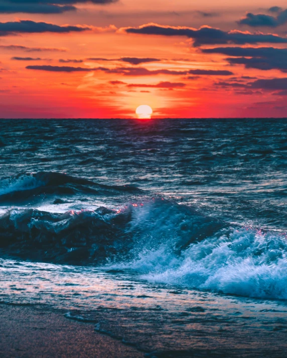 a sunset over the ocean with waves in the foreground, an album cover, pexels contest winner, romanticism, 8k octan photo, colorful picture, mid shot photo, magnetic waves