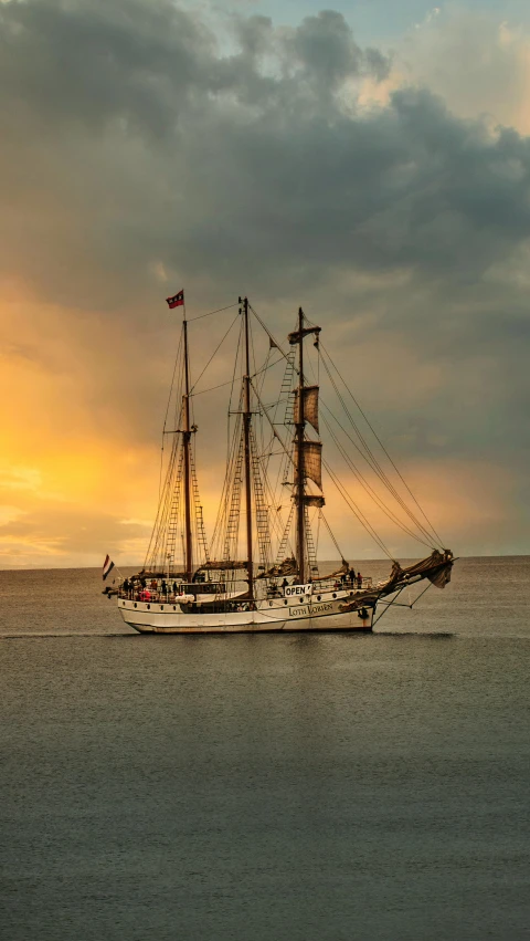 a tall boat floating on top of a body of water, by Erik Pevernagie, pexels contest winner, romanticism, sailing ship, square, evening, tim hildebrant