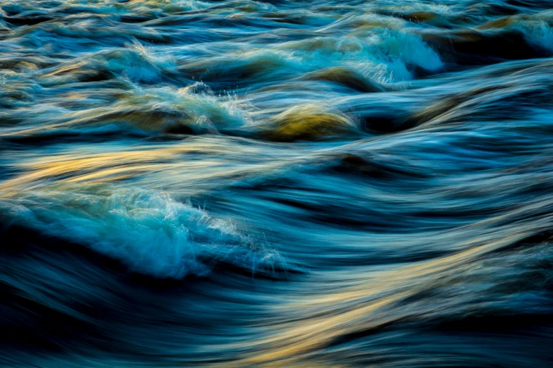 a close up of a body of water with waves, by Peter Churcher, color ( sony a 7 r iv, river rapids, golden and blue hour, fine art print