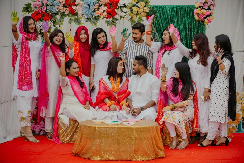 a group of people posing for a picture, pexels contest winner, hurufiyya, pink white and green, decoration, bangladesh, college party