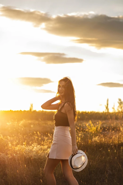 a woman standing in a field holding a frisbee, by Julia Pishtar, trending on unsplash, happening, golden hour 8k, handsome girl, medium format. soft light, avatar image