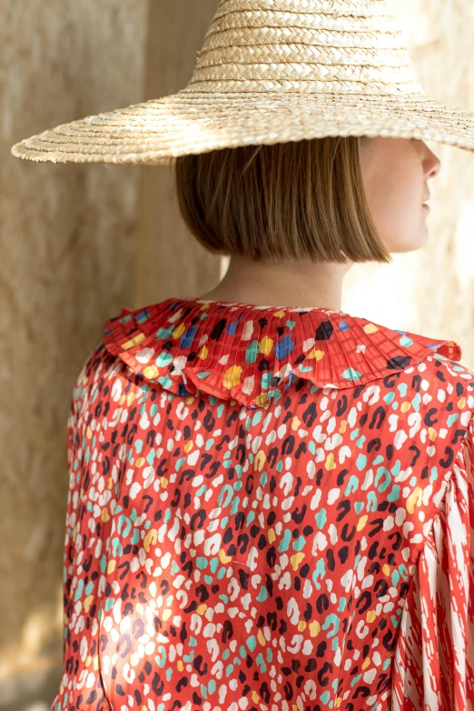 a close up of a person wearing a hat, inspired by Aimé Barraud, bright red cape on her back, spotted, wearing a blouse, detailed product image