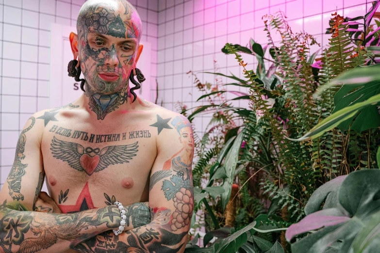 a man with a lot of tattoos on his body, inspired by Seb McKinnon, pexels contest winner, hyperrealism, covered in plants, portrait of a pink gang, taken in the early 2020s, 90s photo