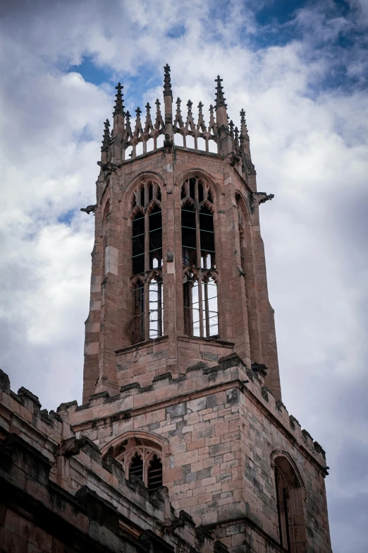 a tall tower with a clock on top of it, by Kev Walker, unsplash, renaissance, coventry city centre, ruined gothic cathedral, top - side view, close-up from above