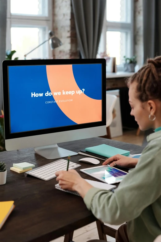 a woman sitting at a desk in front of a computer, a computer rendering, trending on pexels, blue and orange color scheme, teaching, ui and ux, slide show