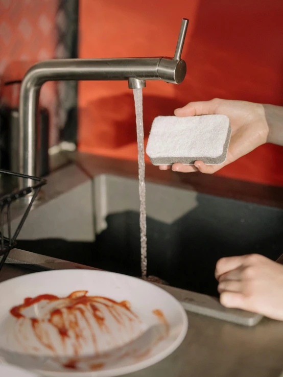 a person washing their hands in a sink, by Adriaen Hanneman, pexels contest winner, process art, dinner is served, white powder bricks, food commercial 4 k, square