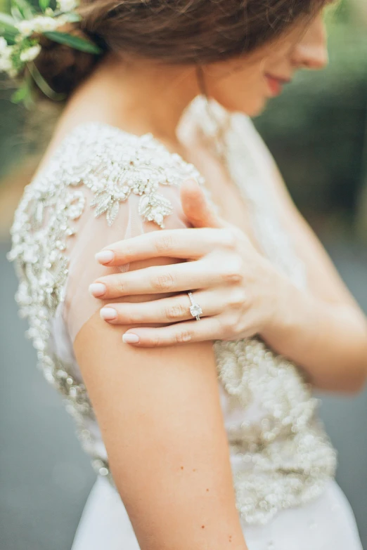 a close up of a woman wearing a wedding dress, a photo, by Arabella Rankin, unsplash, renaissance, elegant up to the elbow, soft colours, 15081959 21121991 01012000 4k, al fresco