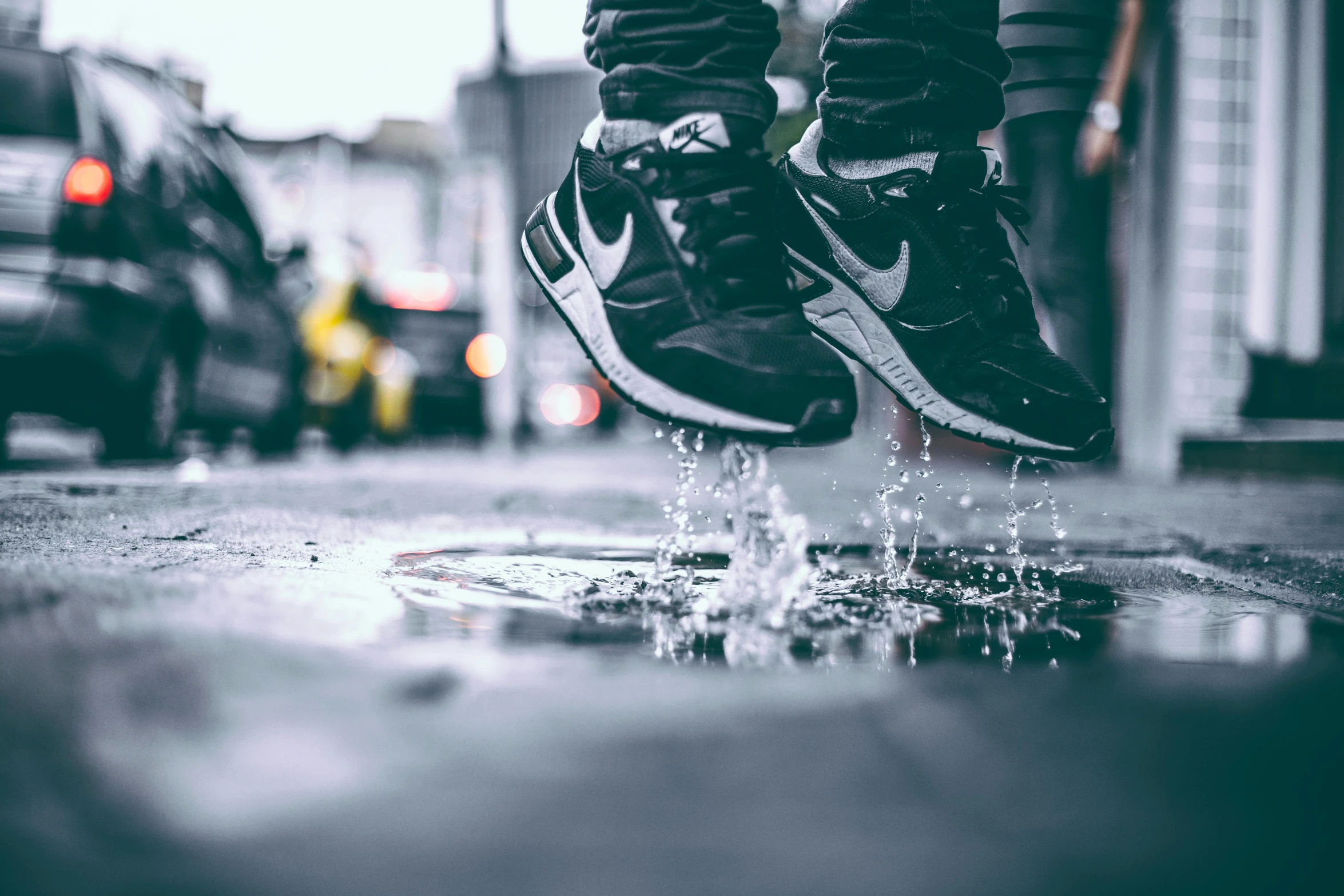 a person standing on top of a puddle of water, trending on unsplash, hyperrealism, nike air max, leaping towards viewer, street wear, “hyper realistic